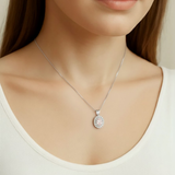 A collection of sparkling Adina Stone rings displayed elegantly on a soft velvet background, showcasing various designs.