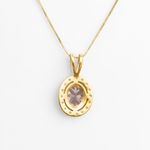 Elegant display of Adina Stone jewelry arranged on a reflective surface, highlighting their brilliance and craftsmanship.