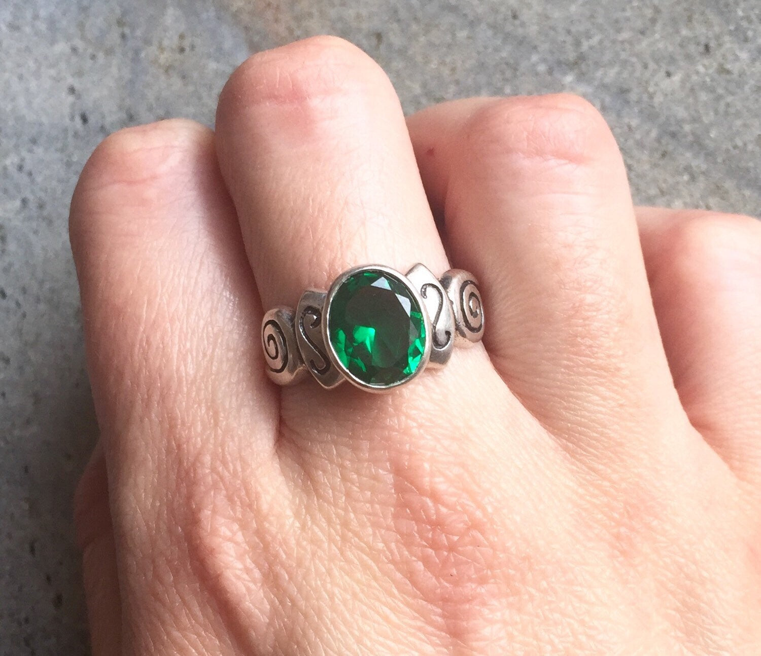 Elegant 925 Sterling Silver ring featuring a stunning oval Created Green Emerald, perfect for May birthdays and special occasions.
