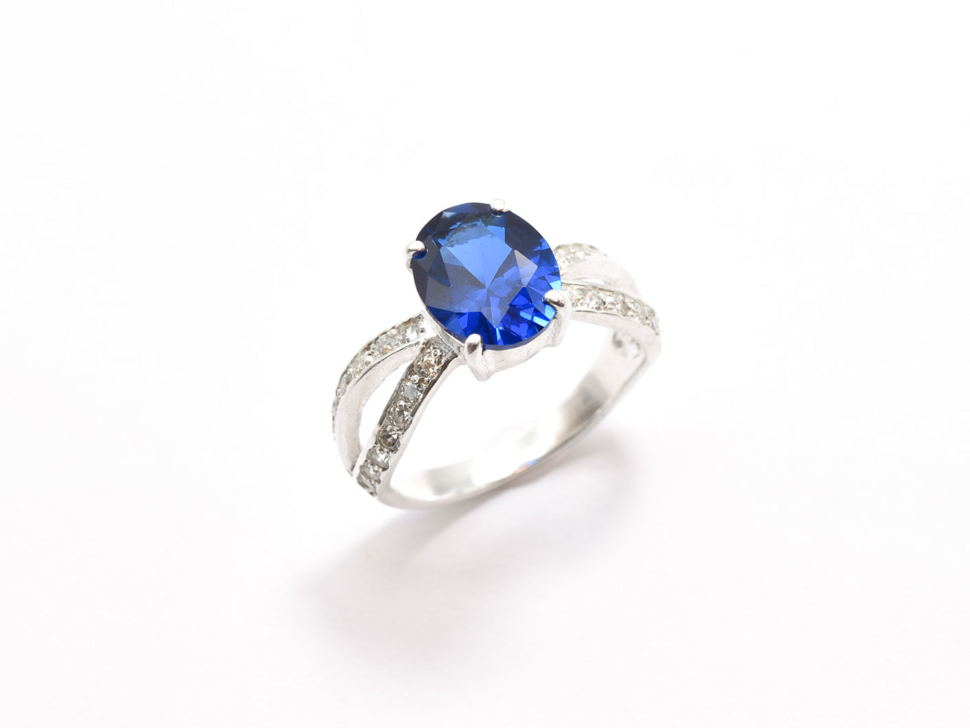 Created Sapphire Ring made in 925 Sterling Silver with Oval Created Blue Sapphire in Solitaire with Accents setting, September Birthstone gift idea, symbolizes sincerity, truth, and faithfulness, ideal for everyday wear and perfect for birthday gifting and special occasions.