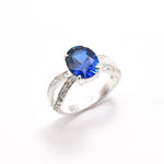 Created Sapphire Ring made in 925 Sterling Silver with Oval Created Blue Sapphire in Solitaire with Accents setting, September Birthstone gift idea, symbolizes sincerity, truth, and faithfulness, ideal for everyday wear and perfect for birthday gifting and special occasions.