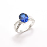 Created Sapphire Ring made in 925 Sterling Silver with Oval Created Blue Sapphire in Solitaire with Accents setting, September Birthstone gift idea, symbolizes sincerity, truth, and faithfulness, ideal for everyday wear and perfect for birthday gifting and special occasions.
