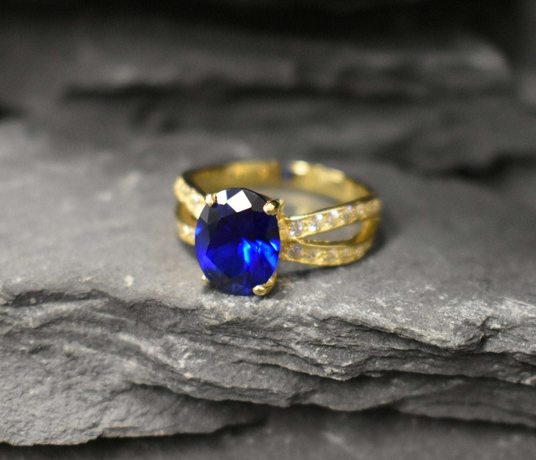 Created Sapphire Ring made in 18k Gold Vermeil with Oval Created Blue Sapphire in Solitaire with Accents setting, September Birthstone gift idea, symbolizes sincerity, truth, and faithfulness, ideal for everyday wear and perfect for birthday gifting and special occasions.