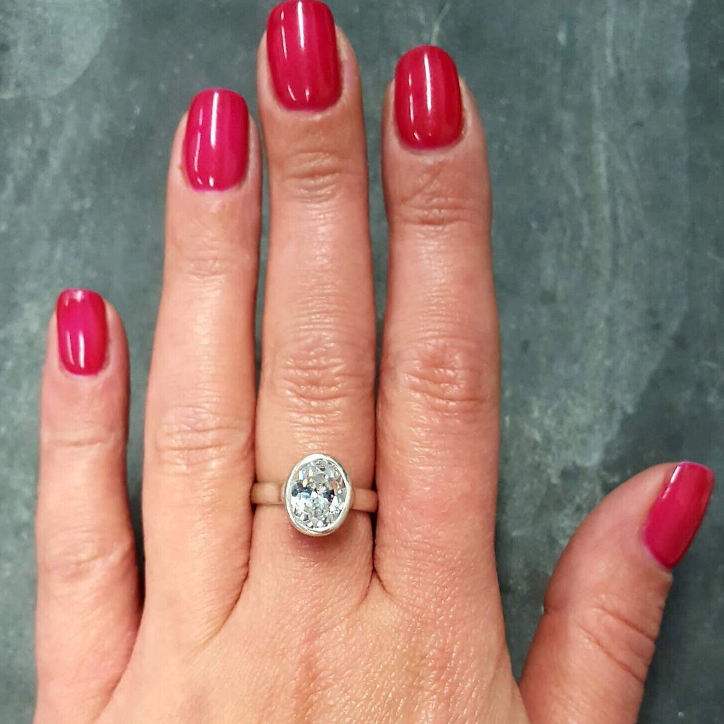 Bezel-set single diamond ring in 925 silver, slender band ideal for daily wear or as a birthday or anniversary gift.