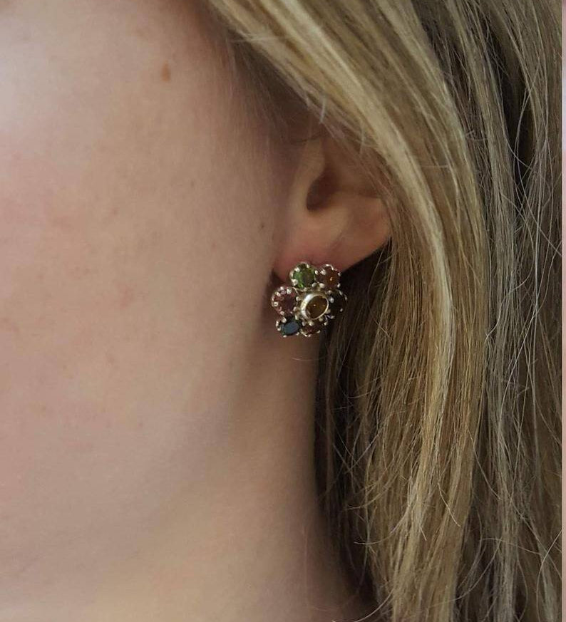 Sapphire earrings in sterling silver with round blue sapphires; ideal for September birthdays and special occasions.