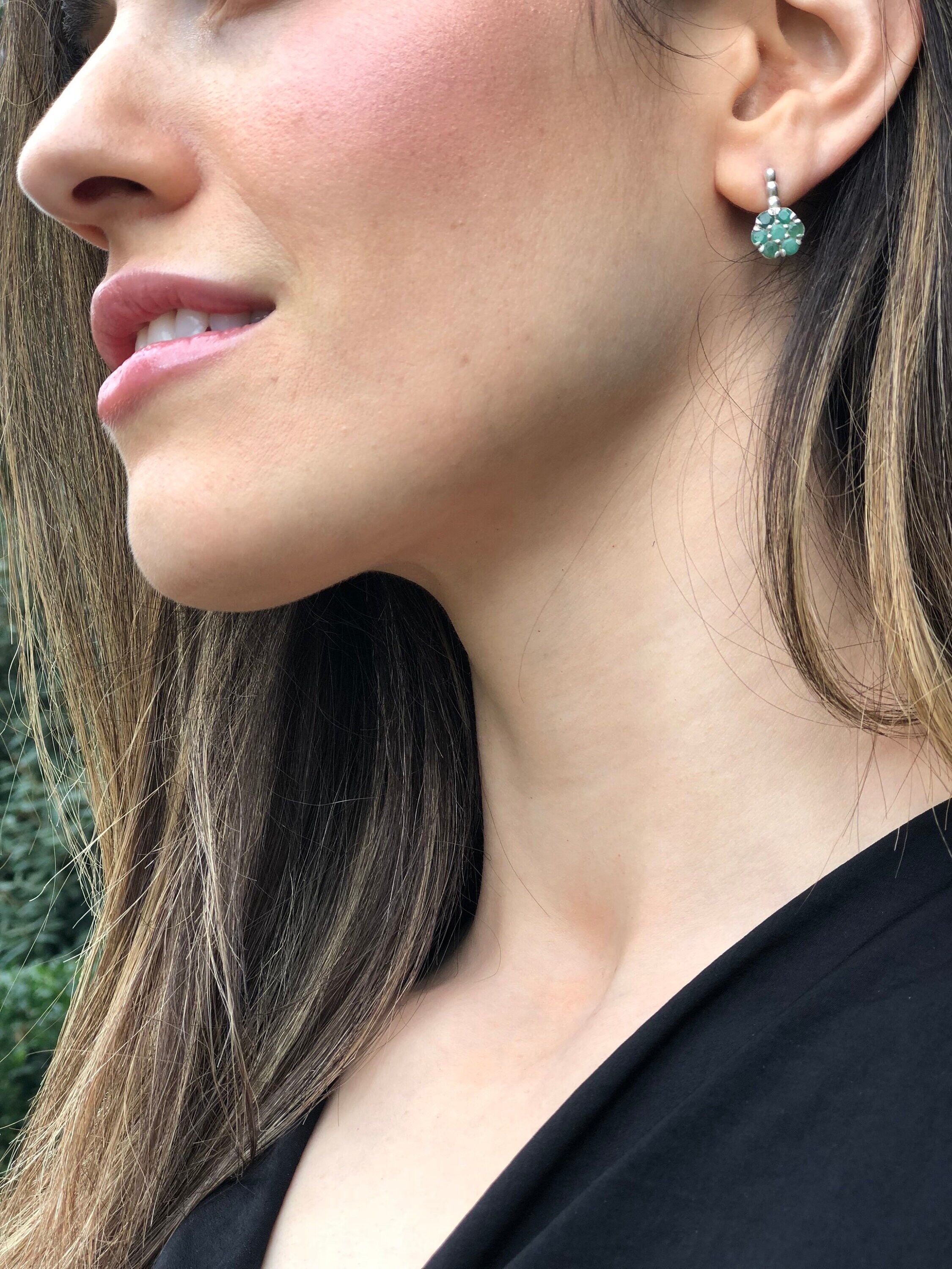 Beautiful 925 Sterling Silver earrings showcasing natural Green Emeralds, representing growth and harmony for special moments.