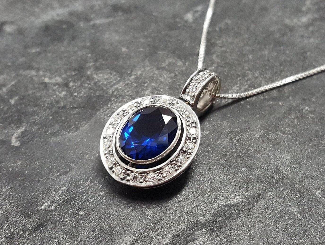 Created Sapphire Pendant made in 925 Sterling Silver with Oval Created Blue Sapphire in Bezel setting, September Birthstone gift idea, symbolizes sincerity, truth, and faithfulness, ideal for everyday wear and perfect for birthday gifting and special occasions.