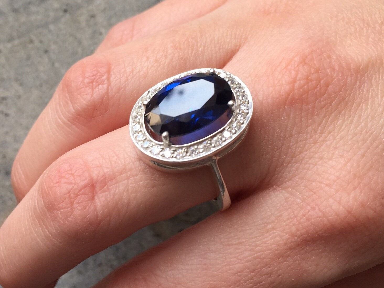 925 Sterling Silver ring featuring an Oval Created Blue Sapphire, perfect for September birthdays and everyday elegance.