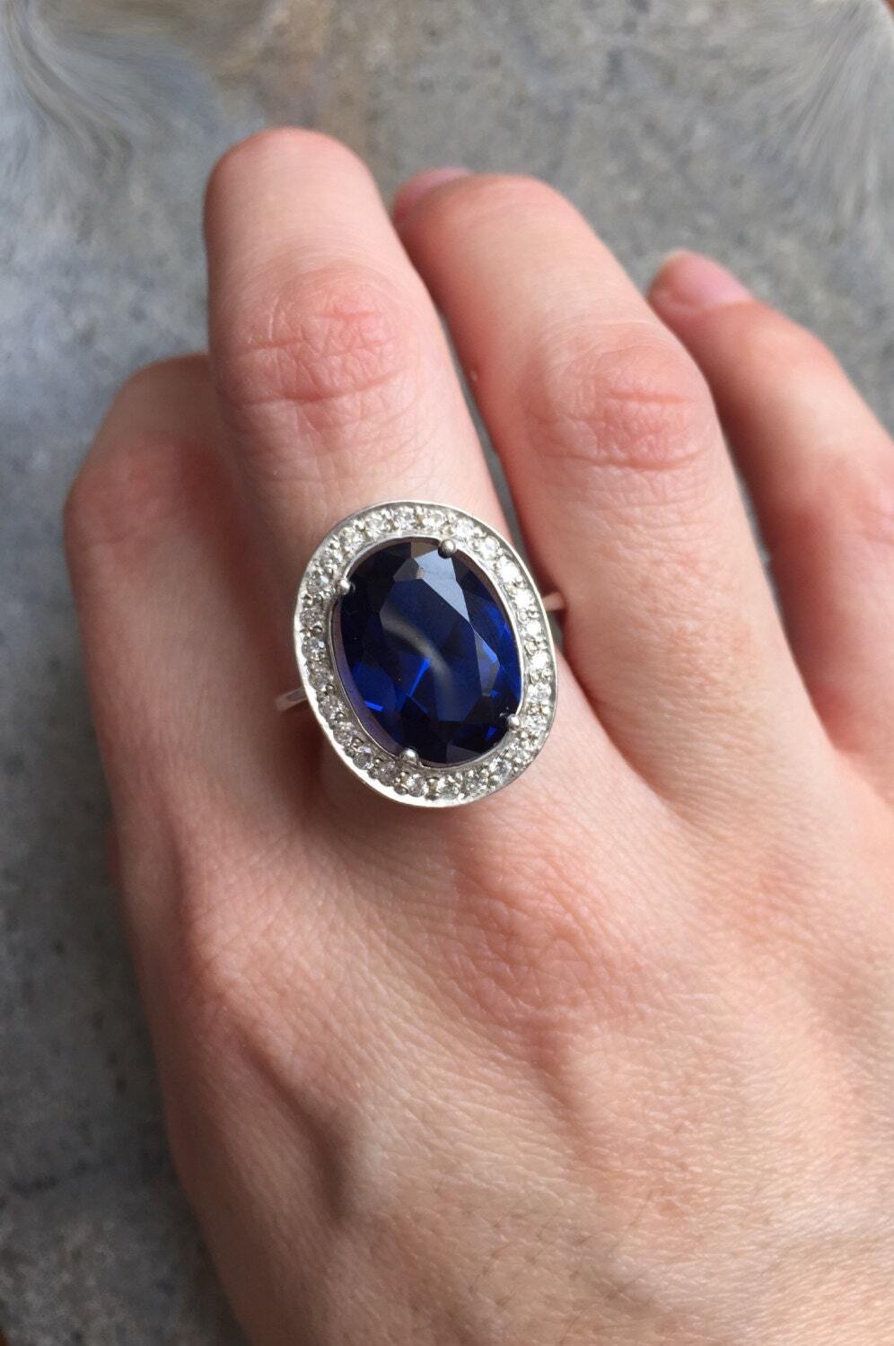 Elegant 925 sterling silver ring with a created blue sapphire, a timeless gift for birthdays and special milestones.