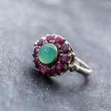 A steaming cup of coffee sits on a wooden table, surrounded by scattered beans and a cozy atmosphere.