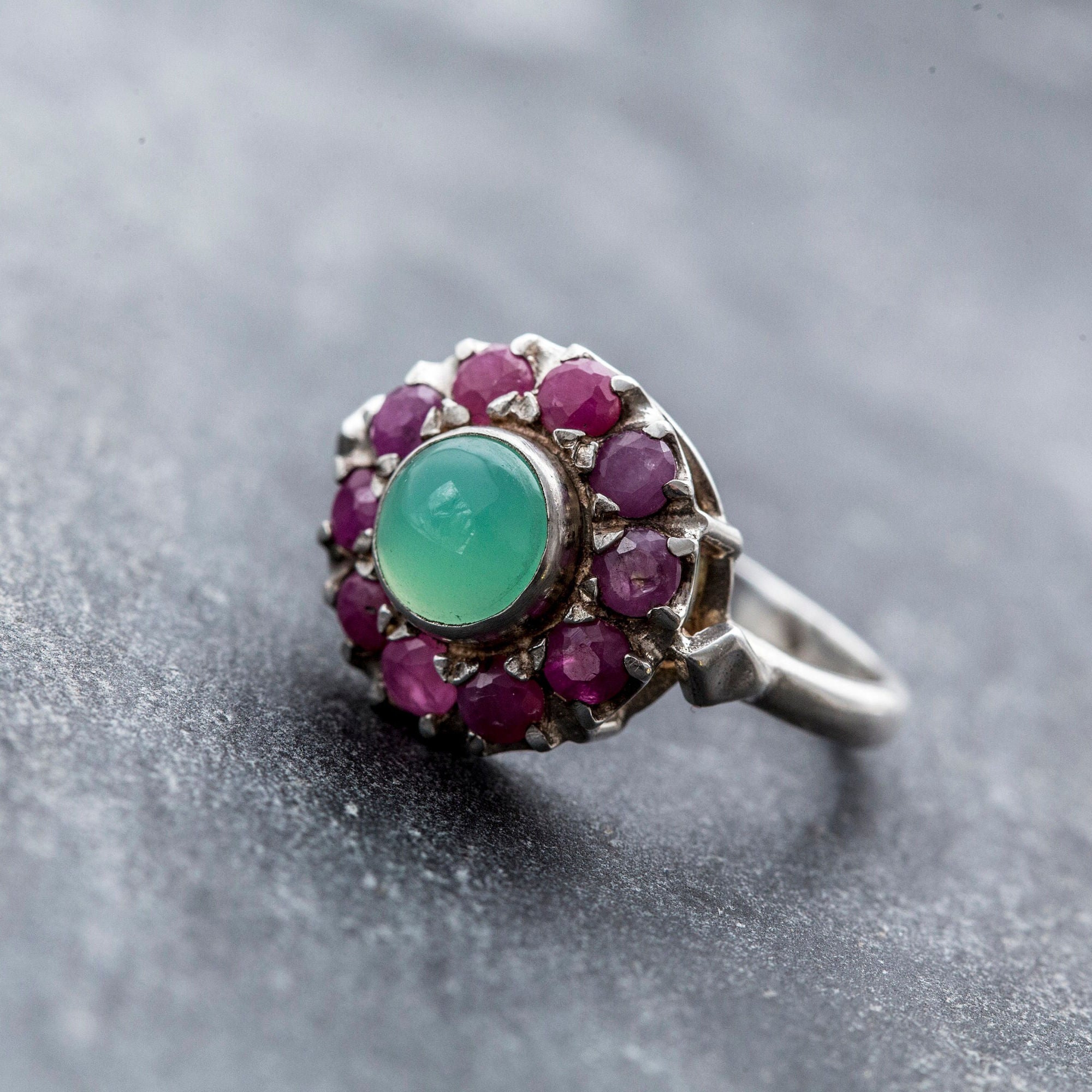 A steaming cup of coffee sits on a wooden table, surrounded by scattered beans and a cozy atmosphere.