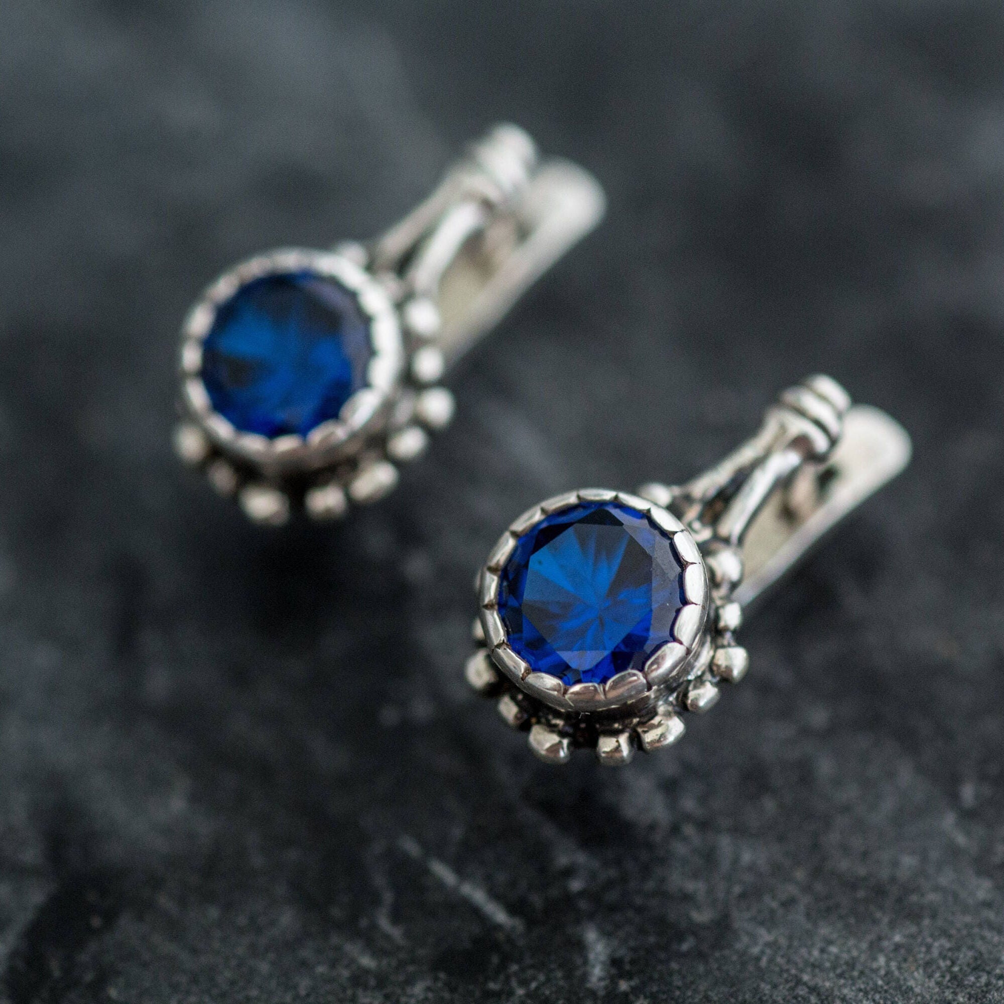 Beautifully crafted 925 Sterling Silver Earrings with Round Created Blue Sapphire, a timeless gift symbolizing loyalty and sincerity.