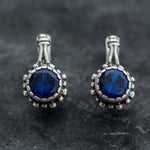 Dazzling 925 Sterling Silver Earrings adorned with Round Created Blue Sapphire, embodying faithfulness and elegance for any event.