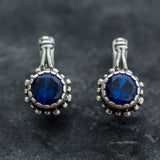 Dazzling 925 Sterling Silver Earrings adorned with Round Created Blue Sapphire, embodying faithfulness and elegance for any event.