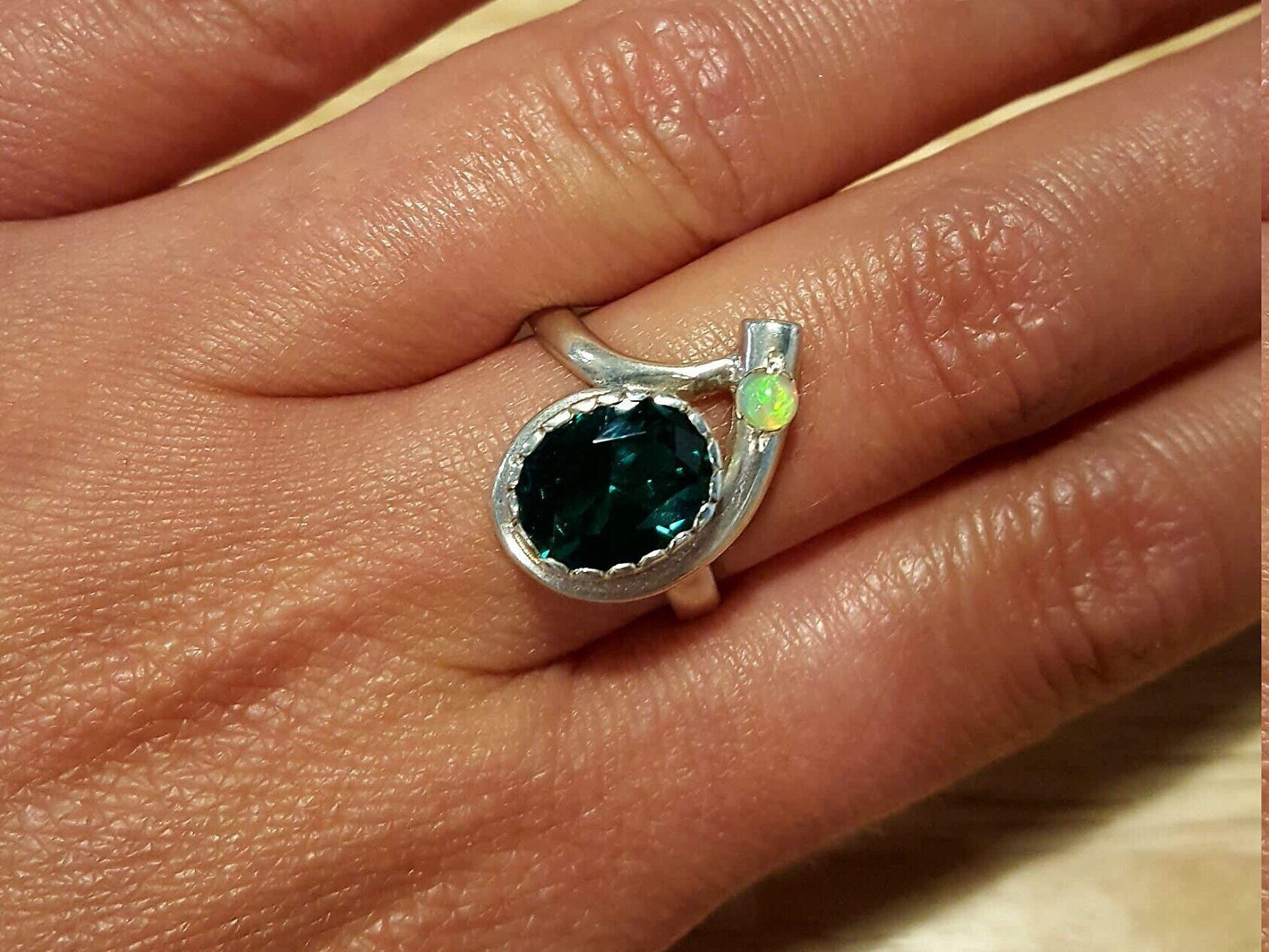 Elegant 925 Sterling Silver ring featuring a stunning oval Created Green Emerald, perfect for May birthdays and special occasions.