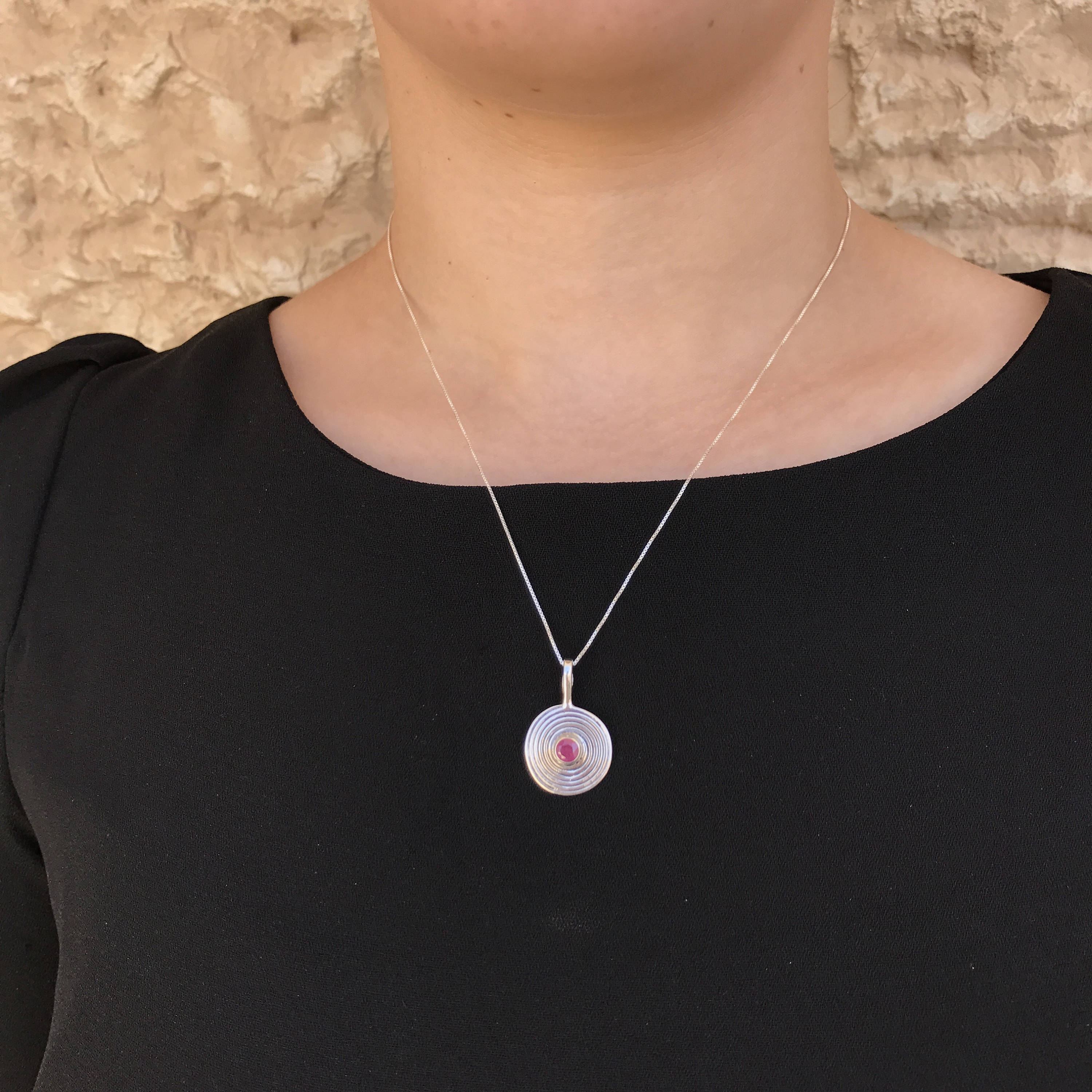 Elegant 925 Sterling Silver Ruby Pendant featuring a round natural red ruby, perfect for birthdays and special occasions.