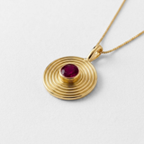 18k gold vermeil bezel pendant with round natural ruby on delicate chain — July birthstone representing nobility and purity.