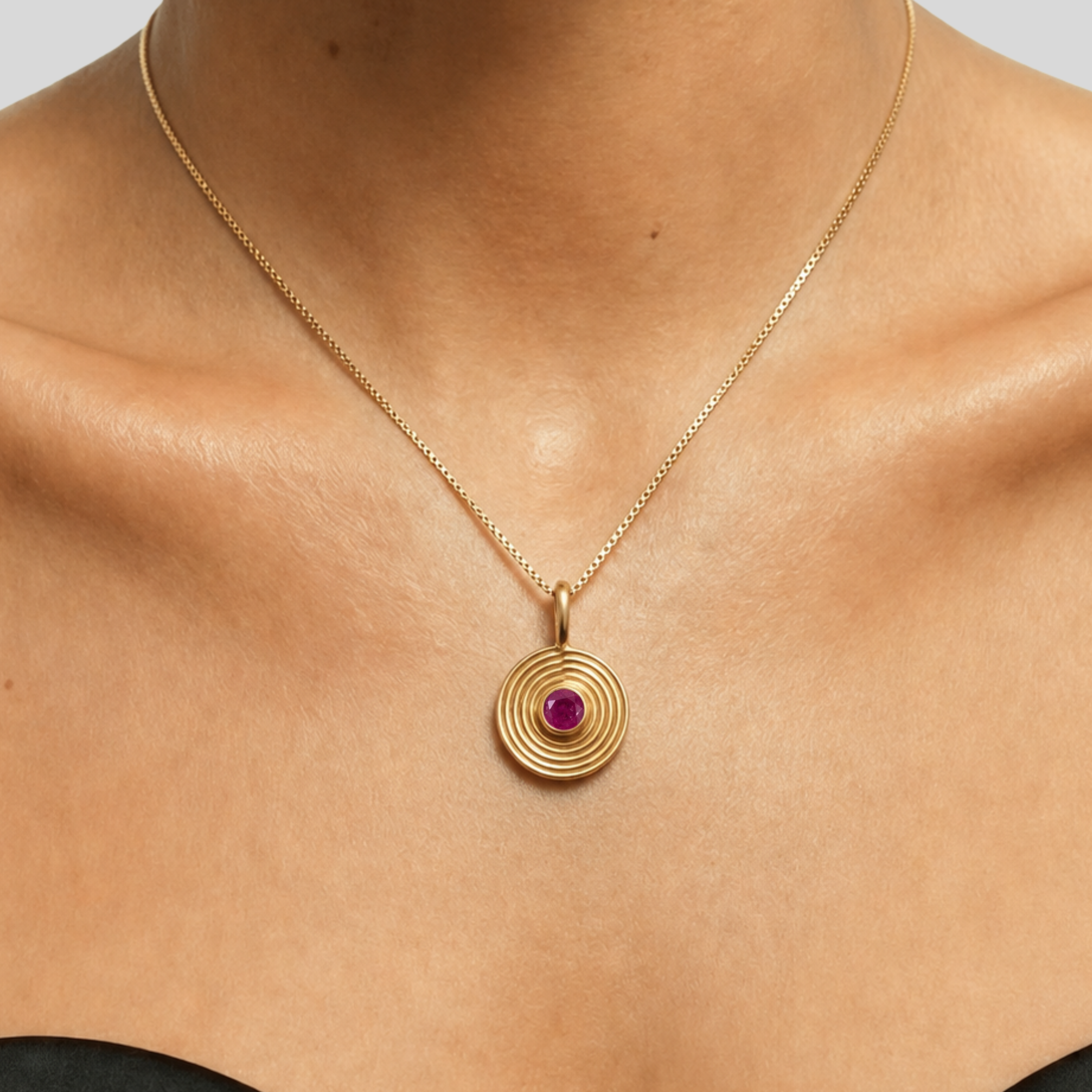 Natural round ruby pendant in 18k gold vermeil bezel on fine chain — July birthstone symbolizing passion.