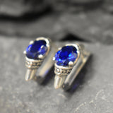 Stylish created sapphire stud earrings in 925 silver, perfect for showcasing elegance and grace on any special occasion.