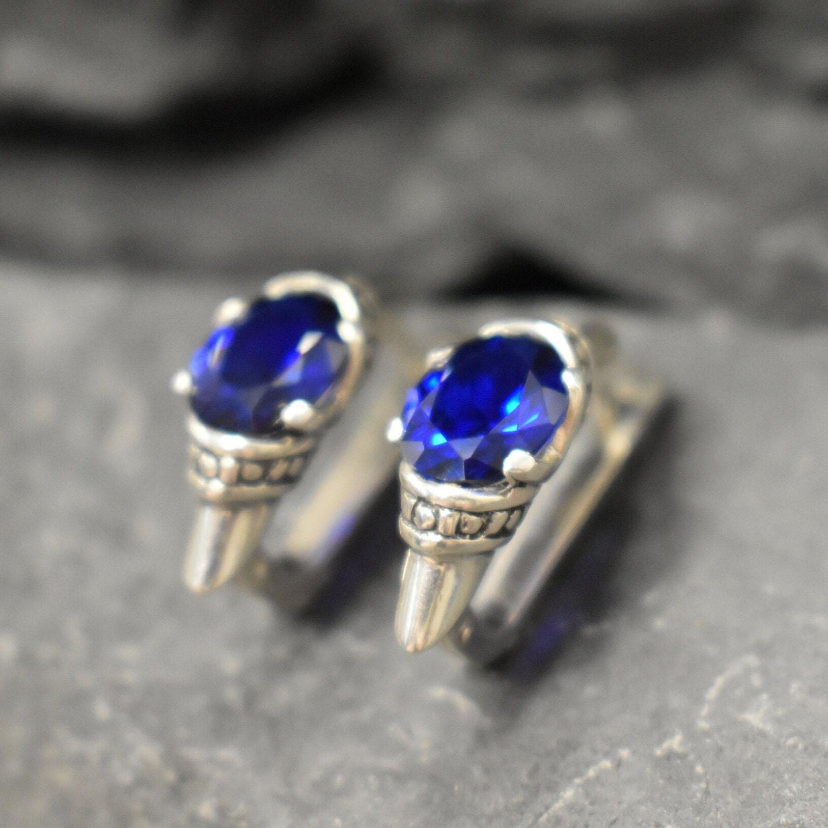 Stylish created sapphire stud earrings in 925 silver, perfect for showcasing elegance and grace on any special occasion.