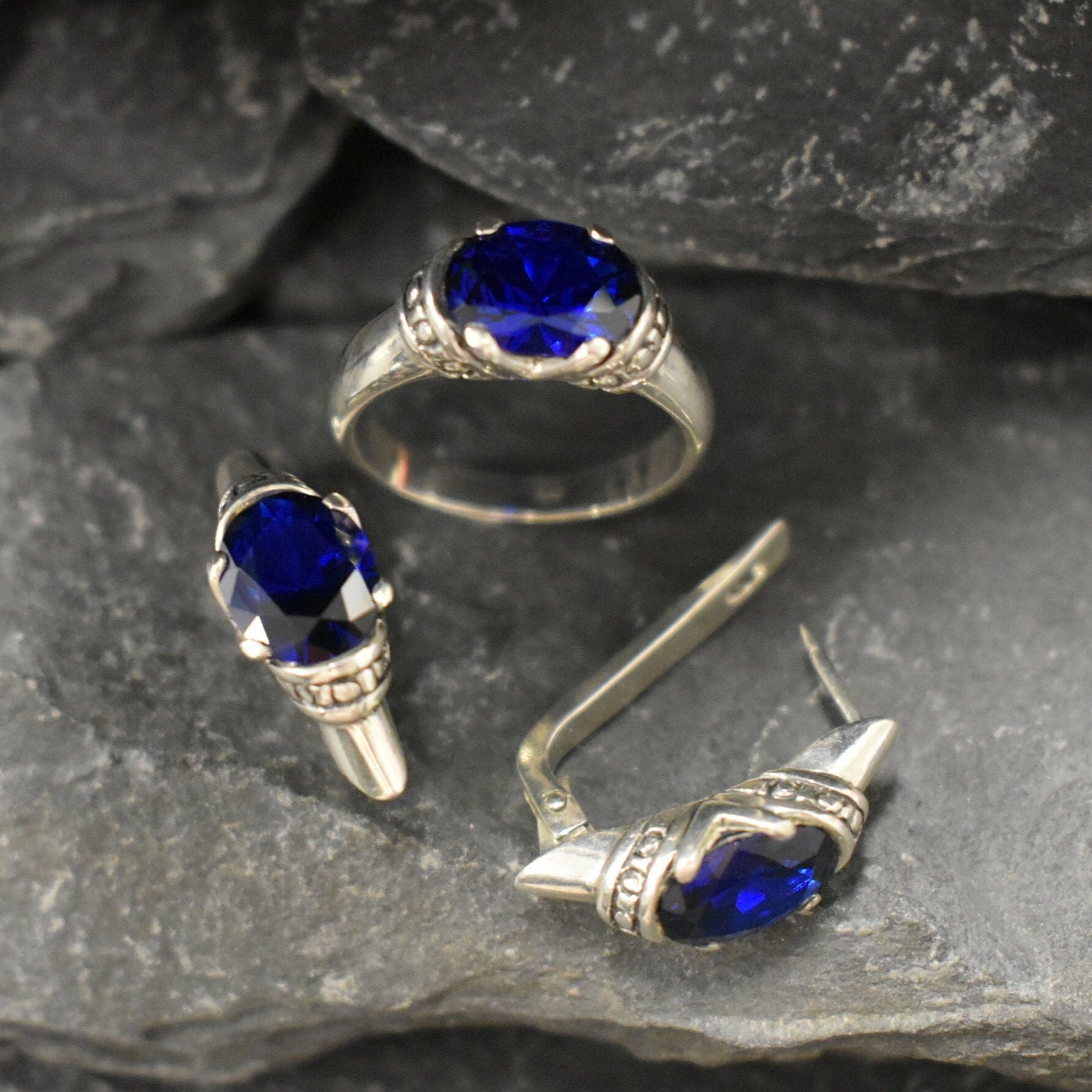 Created sapphire solitaire earrings in sterling silver, perfect gift for September birthdays, embodying elegance and timeless beauty.