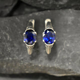 Elegant created sapphire earrings in sterling silver, ideal September birthday gift representing truth and loyalty for any occasion.