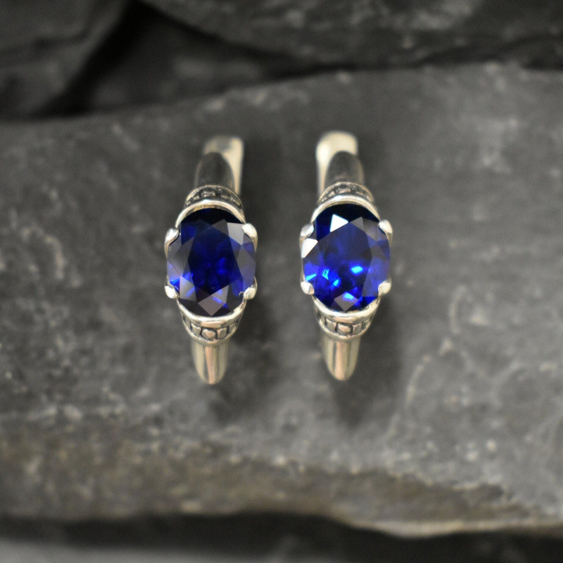 Elegant created sapphire earrings in sterling silver, ideal September birthday gift representing truth and loyalty for any occasion.