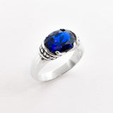Created Sapphire Ring made in 925 Sterling Silver with Oval Created Blue Sapphire in Solitaire setting, September Birthstone gift idea, symbolizes sincerity, truth, and faithfulness, ideal for everyday wear and perfect for birthday gifting and special occasions.