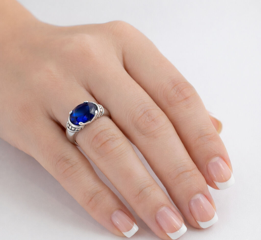 Elegant 925 Sterling Silver ring featuring an Oval Created Blue Sapphire, perfect birthday gift for September.