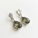 Stylish Teardrop Green Diamond Earrings made of 925 Sterling Silver. Ideal for birthdays and everyday elegance.