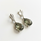 Stylish Teardrop Green Diamond Earrings made of 925 Sterling Silver. Ideal for birthdays and everyday elegance.