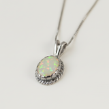 Elegant 925 Sterling Silver pendant showcasing a shimmering oval Ethiopian Opal, ideal for special occasions and daily elegance.