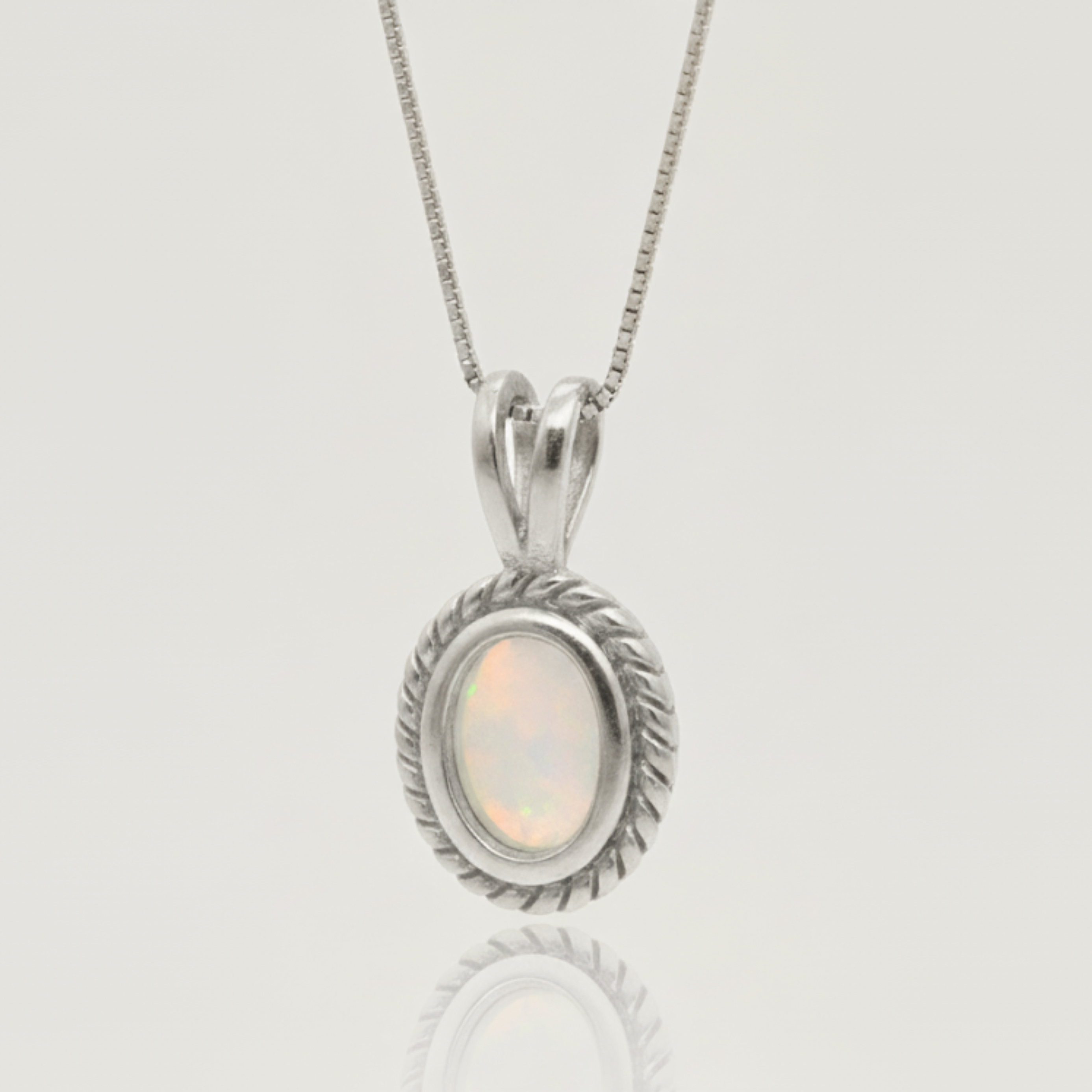 Natural Fire Ethiopian Opal set in 925 Sterling Silver, a beautiful pendant symbolizing purity, great for every day and special events.
