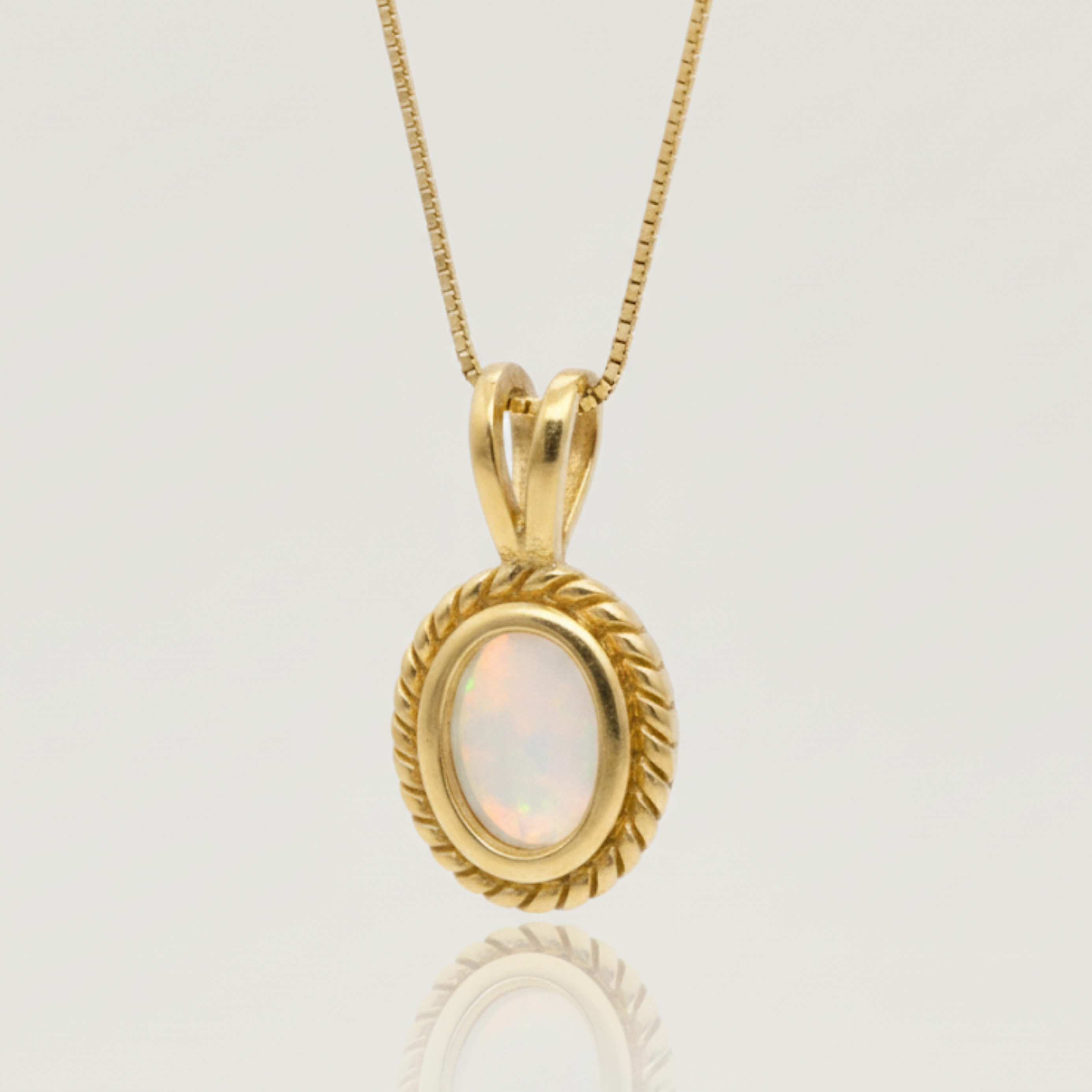 Stunning 18k Gold Vermeil pendant with a vibrant Oval Natural Fire Ethiopian Opal, a symbol of October birthstone charm.