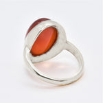 A close-up of a statement carnelian ring set in solid 925 sterling silver