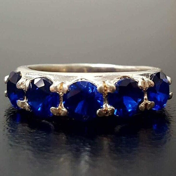 Beautifully crafted 925 Sterling Silver ring with a Round Created Blue Sapphire, a meaningful gift for celebrating special moments.