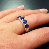 Crafted in 925 Sterling Silver, this ring features a Round Created Blue Sapphire, ideal for those who cherish sincerity and style.