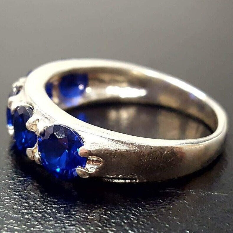 Timeless 925 Sterling Silver ring adorned with a Round Created Blue Sapphire, perfect for expressing love and elegance on any occasion.