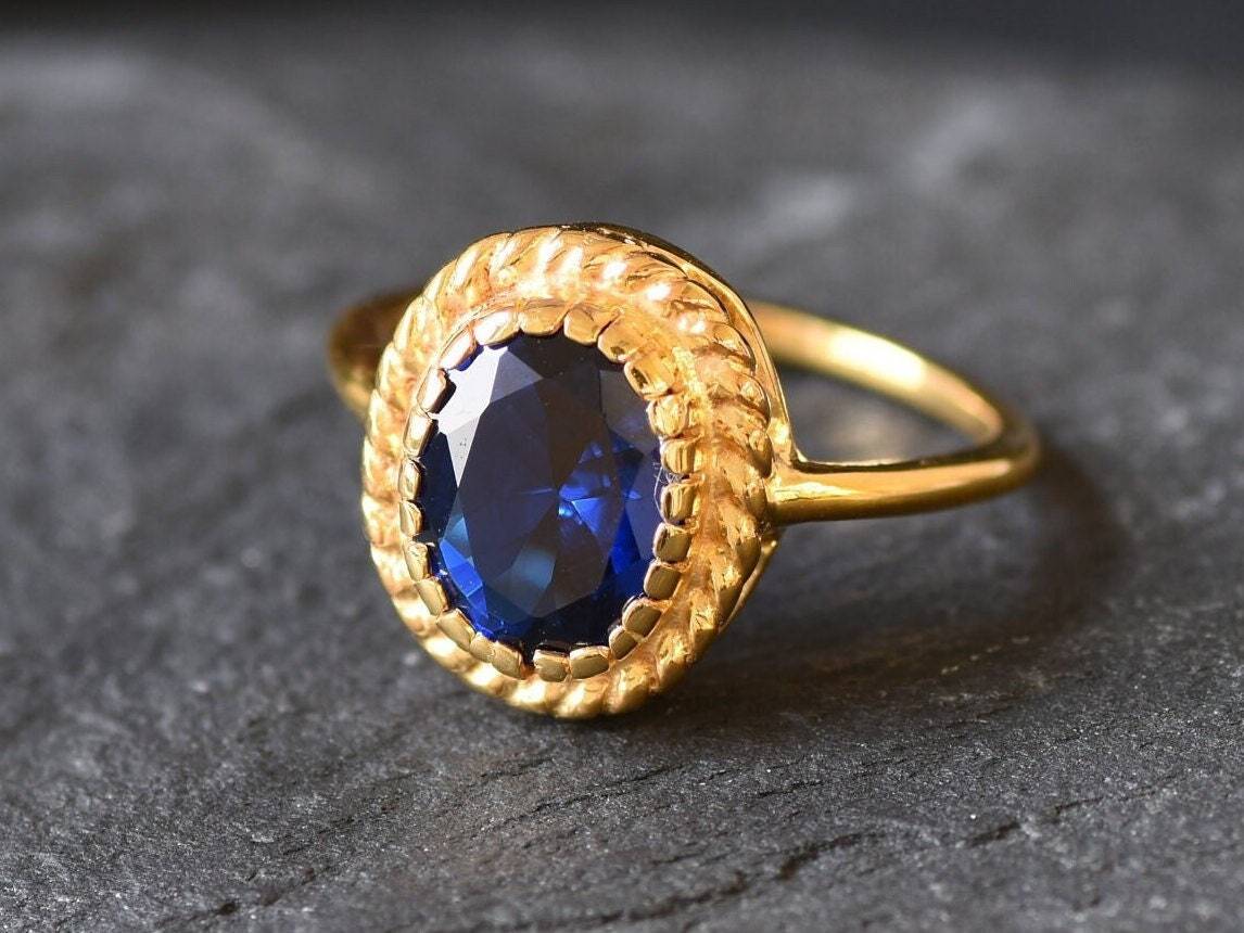 Created Sapphire Ring made in 18k Gold Vermeil with Oval Created Blue Sapphire in Solitaire setting, September Birthstone gift idea, symbolizes sincerity, truth, and faithfulness, ideal for everyday wear and perfect for birthday gifting and special occasions.