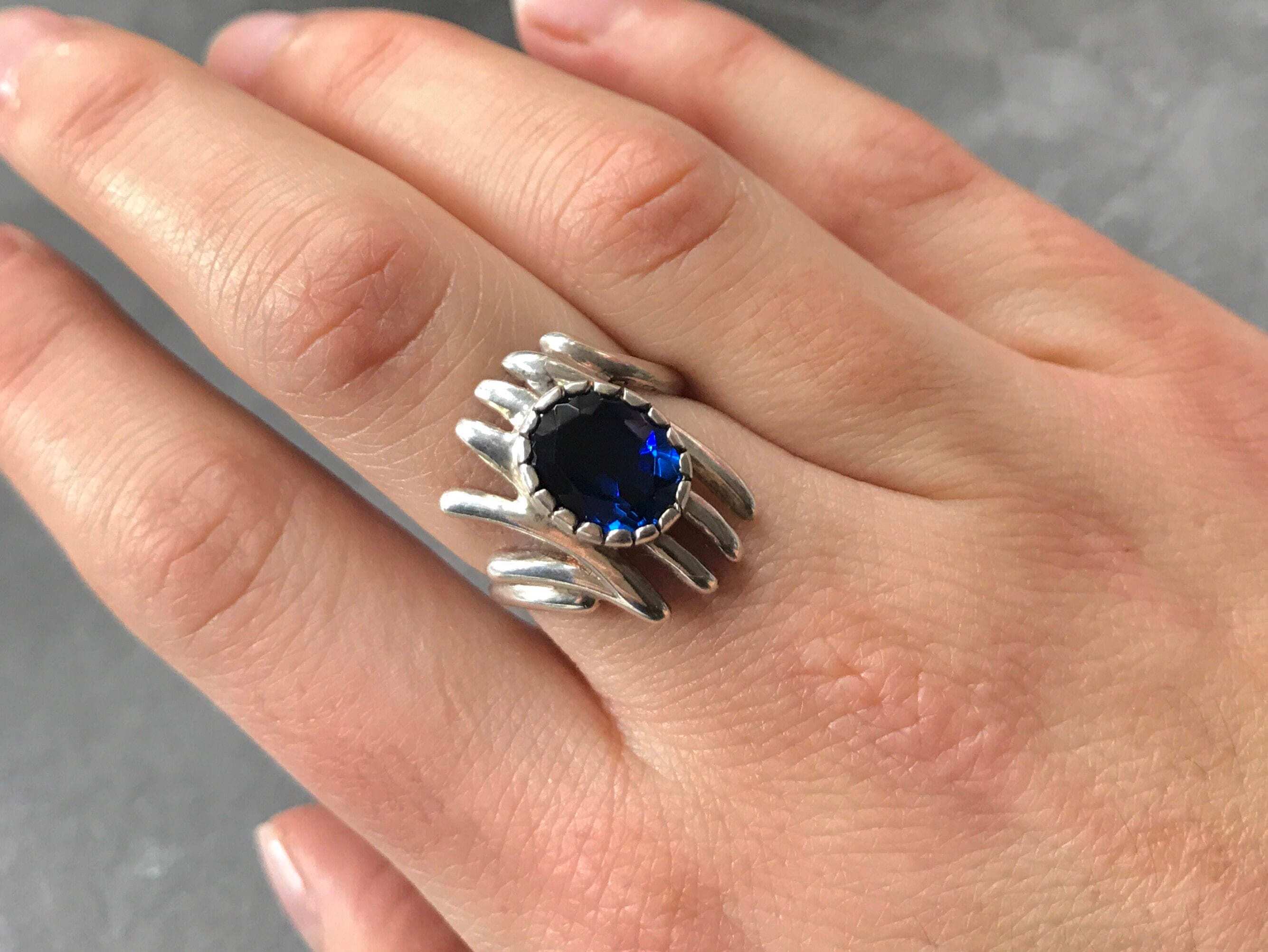 Elegant 925 Sterling Silver created sapphire ring, prong set with oval blue sapphire, perfect for birthdays and special occasions.