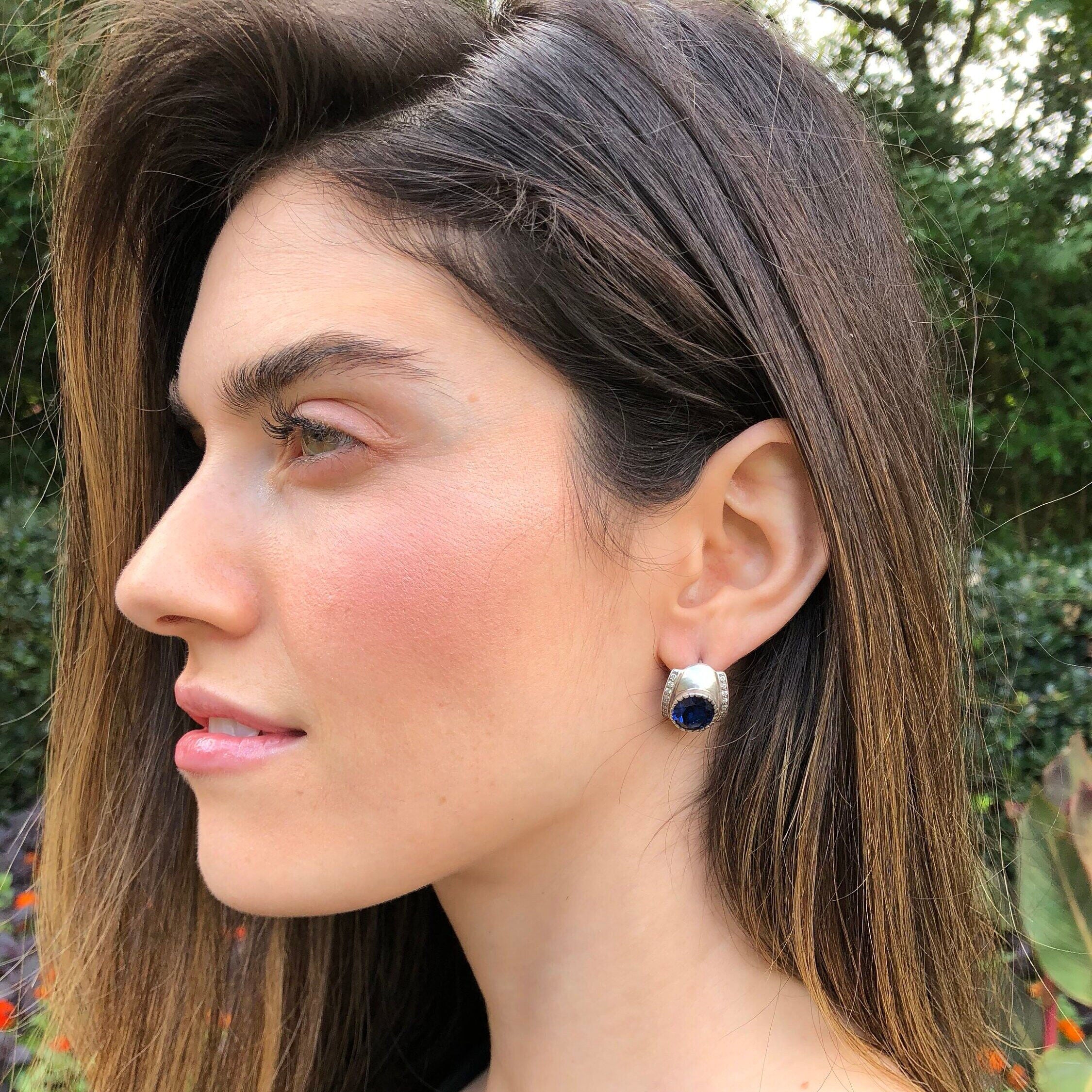 Beautiful 925 Sterling Silver earrings with oval created blue sapphire, a symbol of faithfulness, perfect for any occasion.