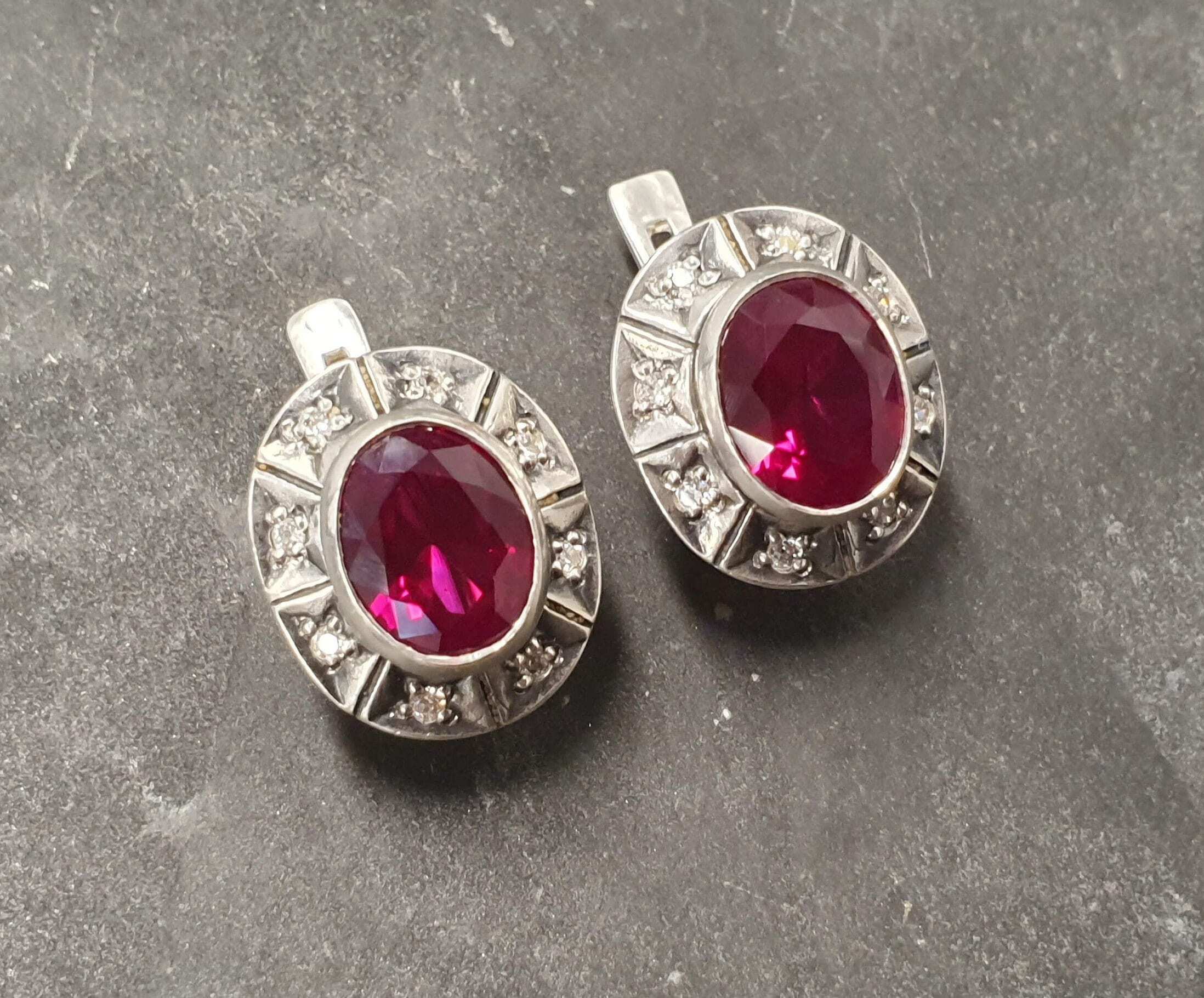 Created Ruby Earrings made in 925 Sterling Silver with Oval Created Red Ruby in Bezel setting, July Birthstone gift idea, symbolizes nobility, purity, and passion, ideal for everyday wear and perfect for birthday gifting and special occasions.