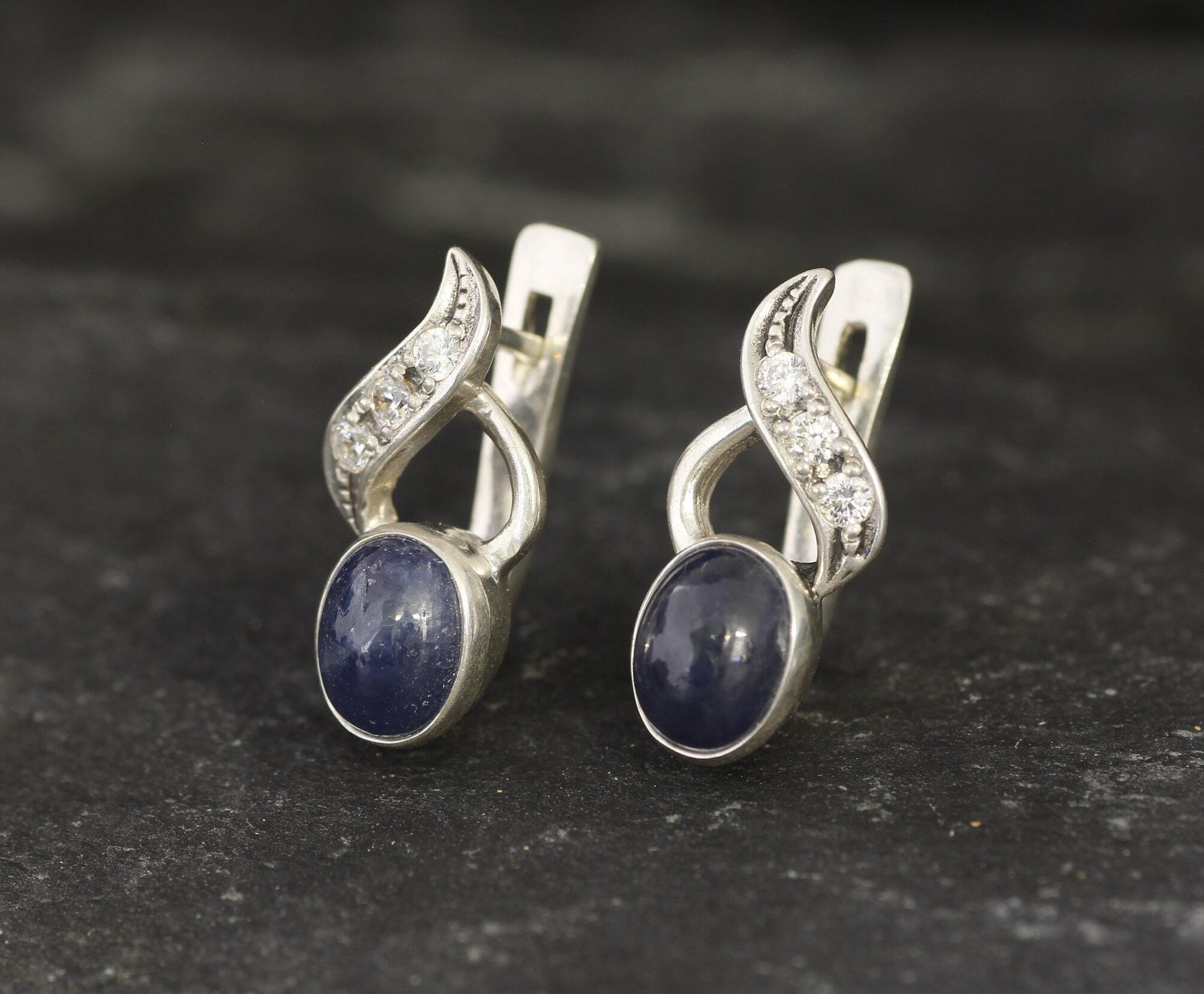 Natural Sapphire Earrings made in 925 Sterling Silver with Oval Natural Blue Sapphire in Bezel setting, September Birthstone gift idea, symbolizes sincerity, truth, and faithfulness, ideal for everyday wear and perfect for birthday gifting and special occasions.