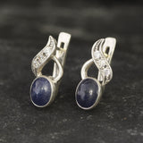 Natural Sapphire Earrings made in 925 Sterling Silver with Oval Natural Blue Sapphire in Bezel setting, September Birthstone gift idea, symbolizes sincerity, truth, and faithfulness, ideal for everyday wear and perfect for birthday gifting and special occasions.