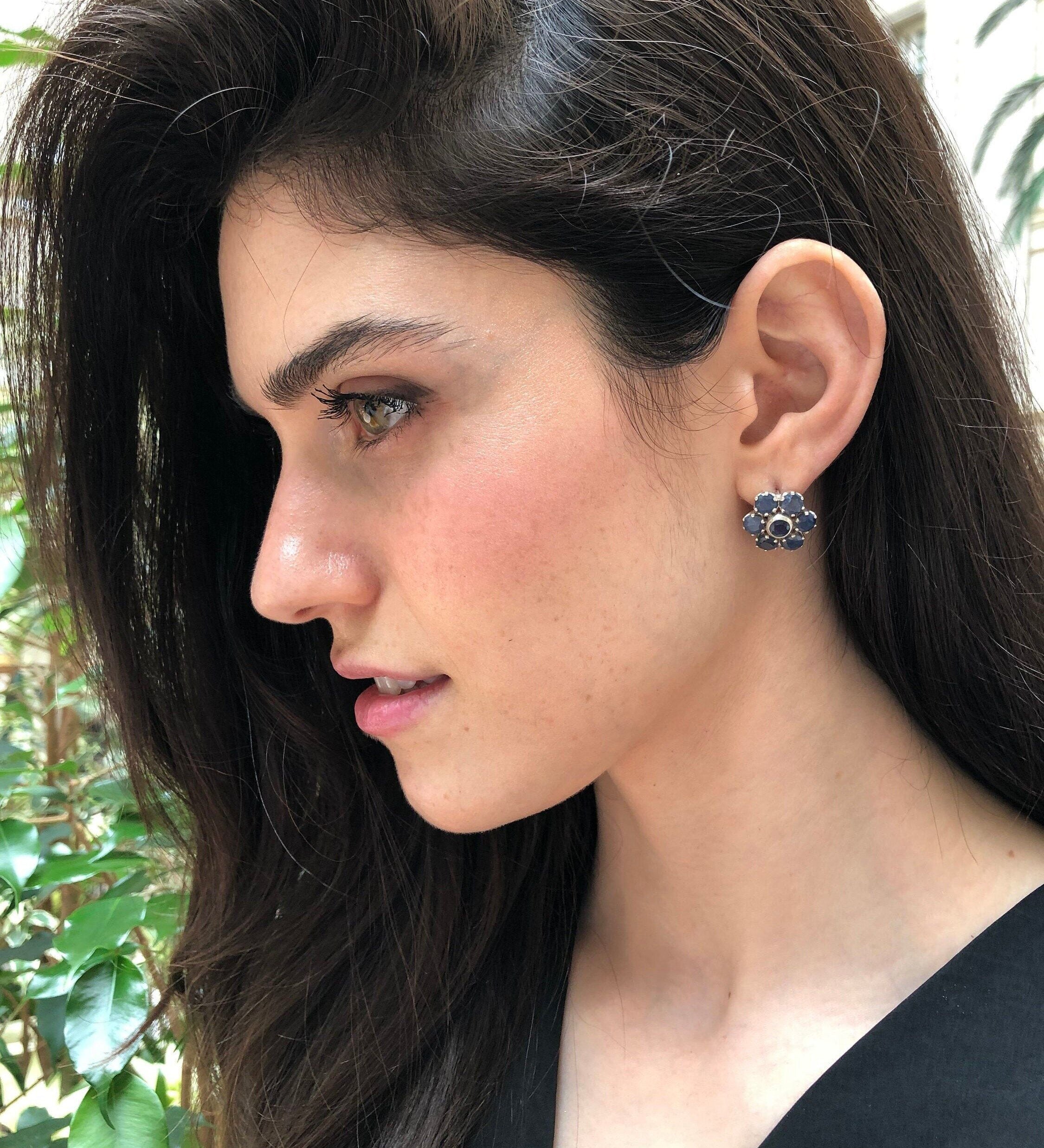 Elegant cluster earrings featuring round natural blue sapphires in 925 sterling silver, perfect for birthdays and special occasions.