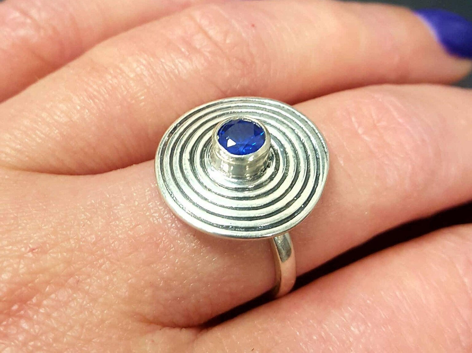Created Sapphire Ring in 925 Sterling Silver, featuring a round blue sapphire, perfect for September birthdays and special occasions.