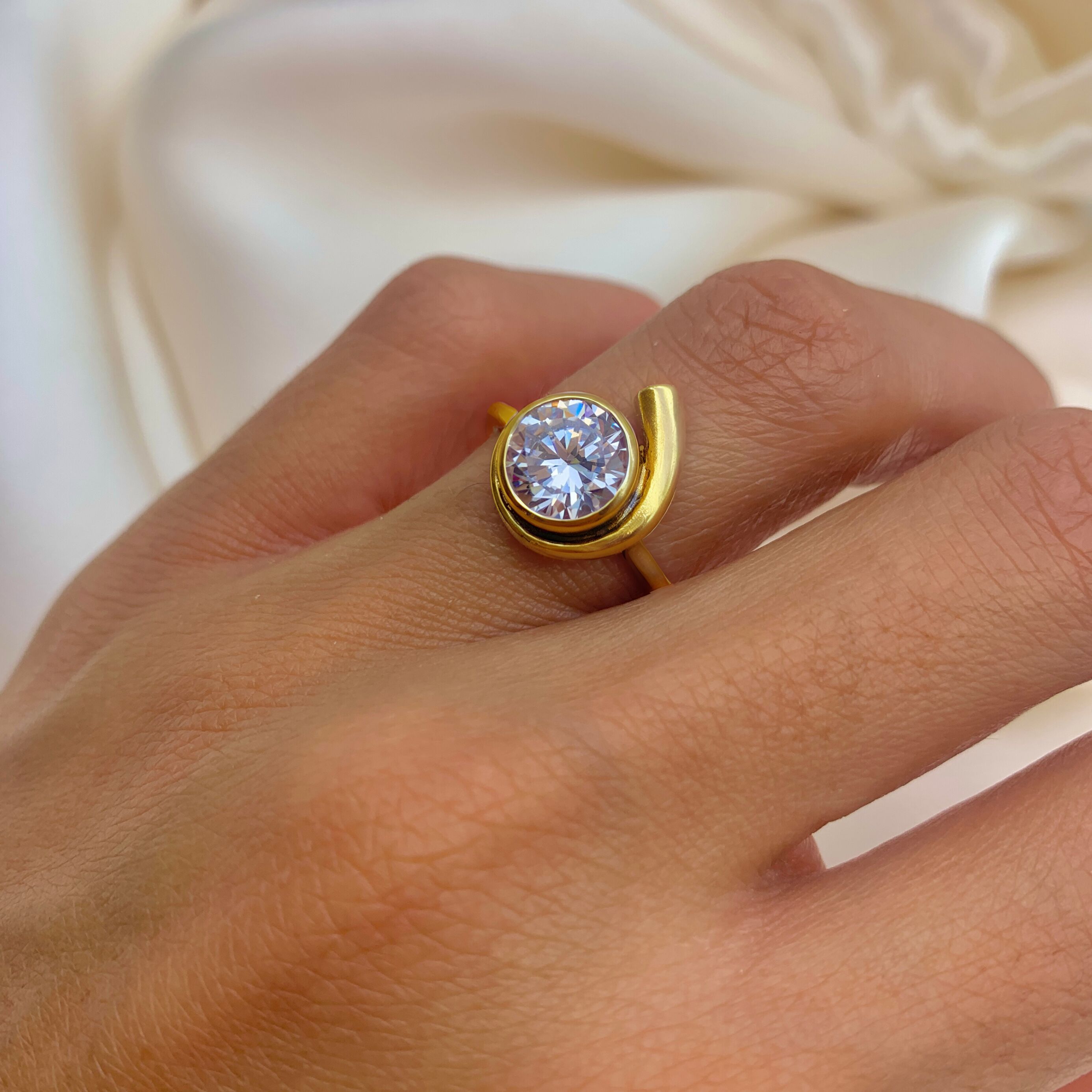Gold Diamond Ring worn on ring finger