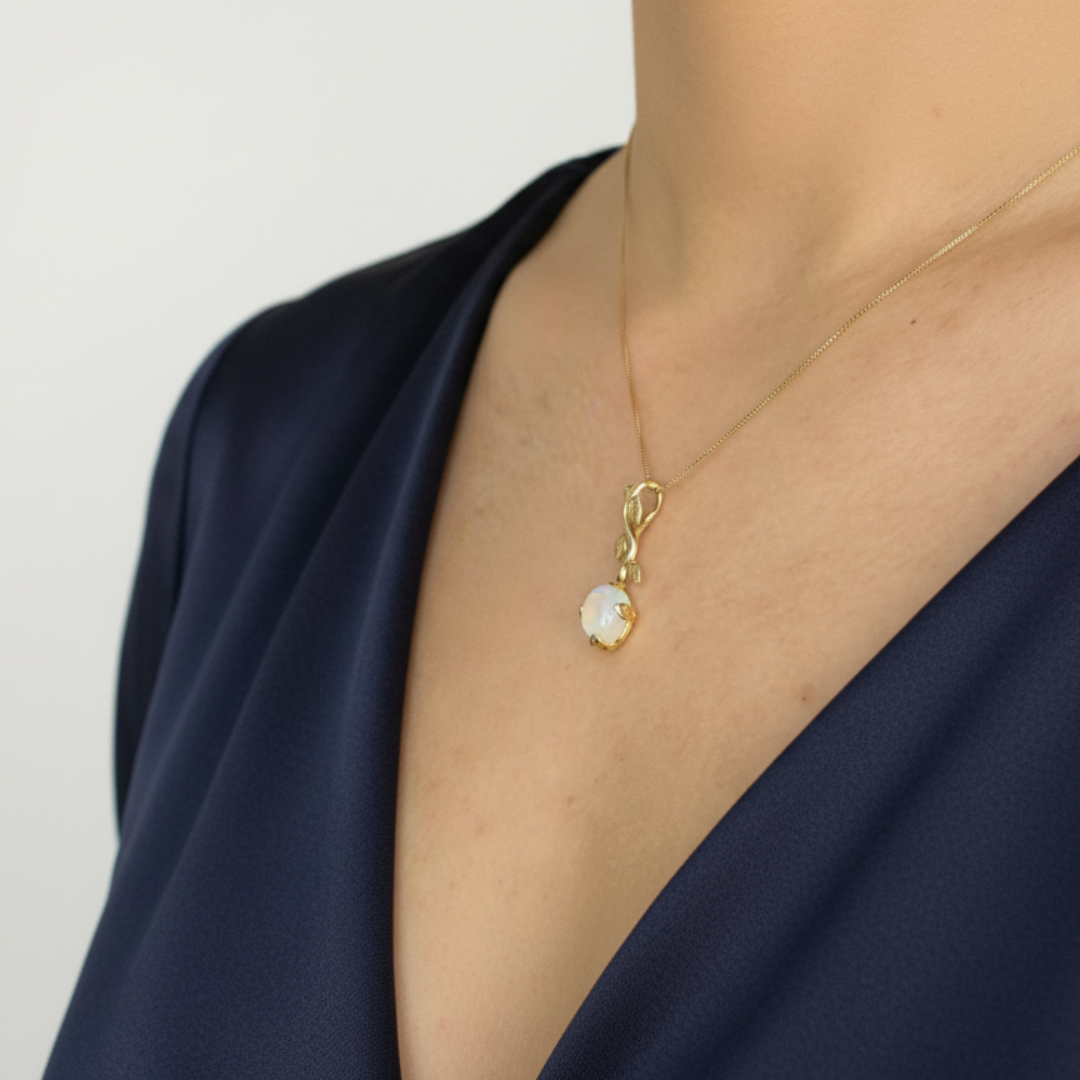 Charming 18k Gold Vermeil Moonstone Pendant featuring a vibrant oval stone, ideal for adding a touch of elegance to any outfit.