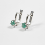 Stylish round natural emerald earrings in 925 sterling silver, symbolizing harmony—great for special occasions and daily use.