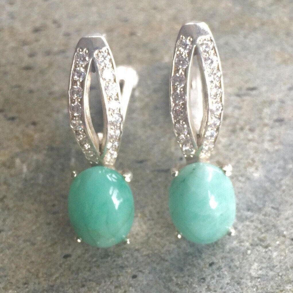 Natural Emerald Earrings made in 925 Sterling Silver with Oval Natural Green Emerald in Solitaire with Accents setting, May Birthstone gift idea, symbolizes growth, harmony, and deep emotional healing, ideal for everyday wear and perfect for birthday gifting and special occasions.